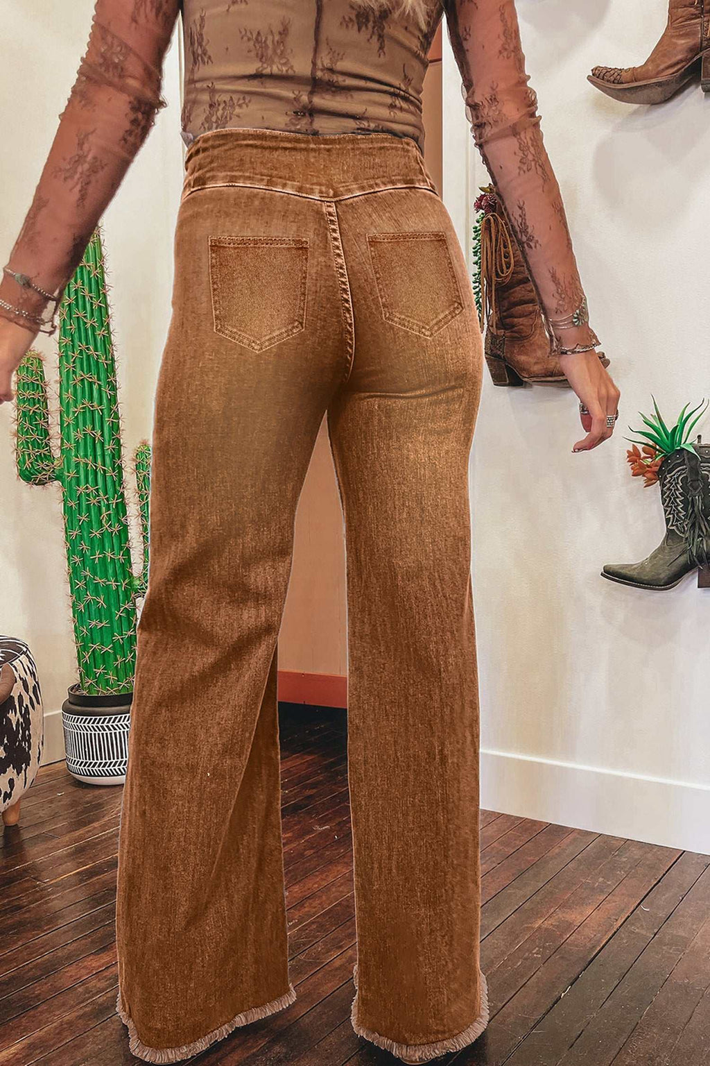Coffee High Waist flare jeans in brown denim with raw hem, seamed detailing, and back pockets for a vintage look.