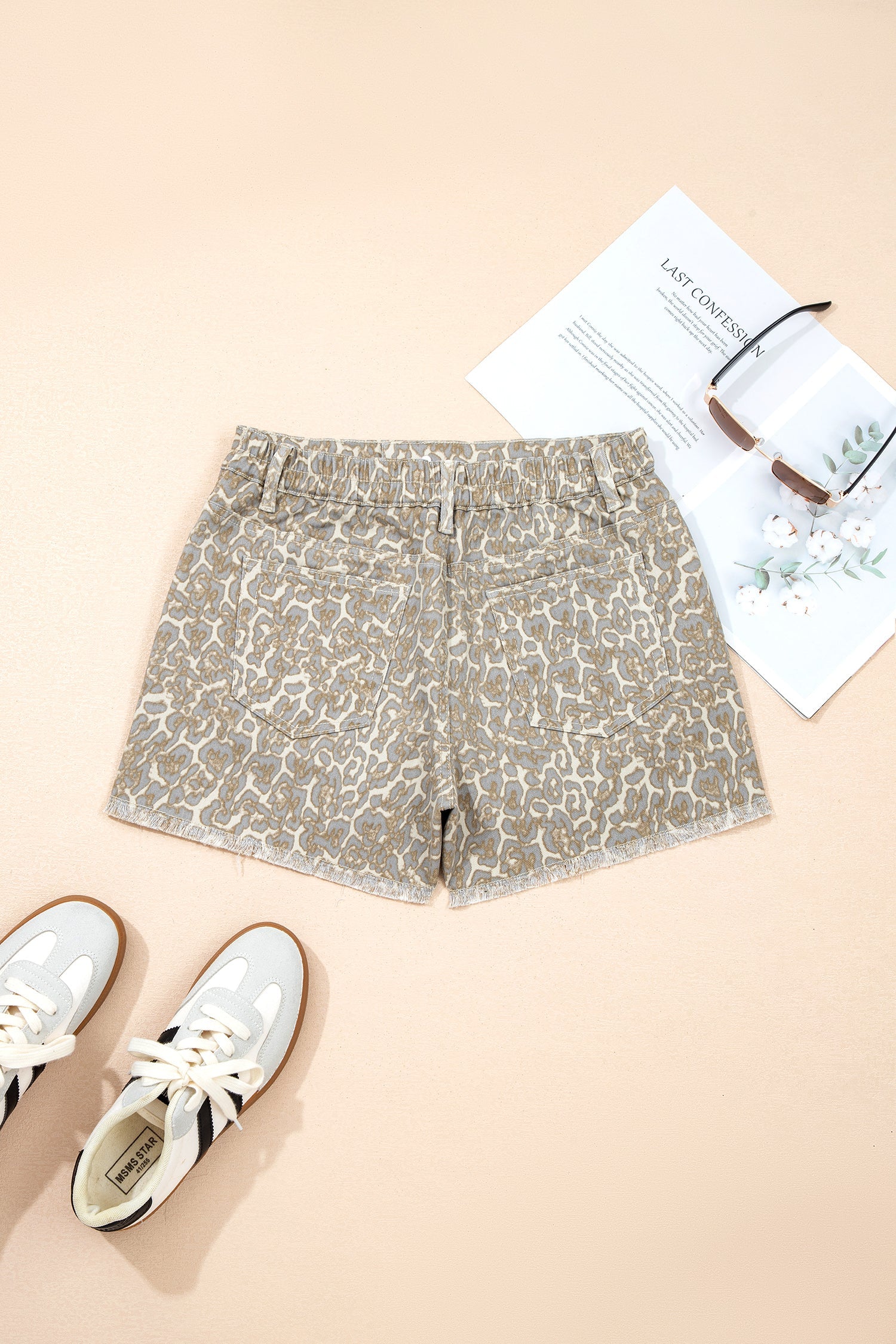 Khaki raw edge leopard print denim shorts with bold design and durable fabric