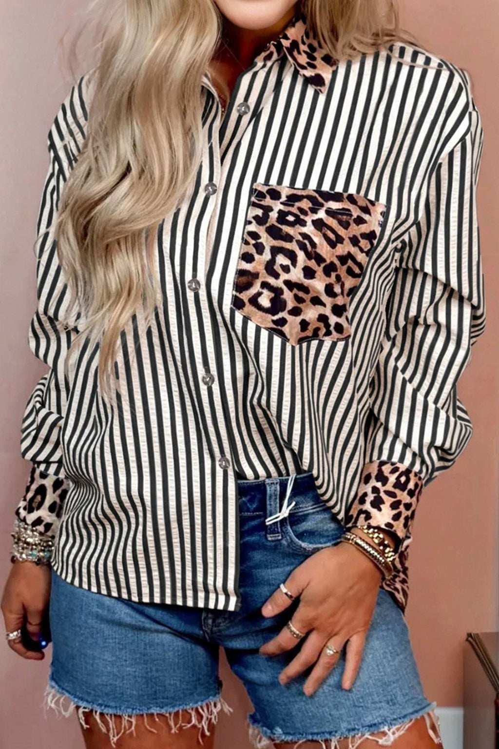 Striped button-up shirt with leopard print collar, pocket, and cuffs, styled with denim shorts in Racing Red tones.