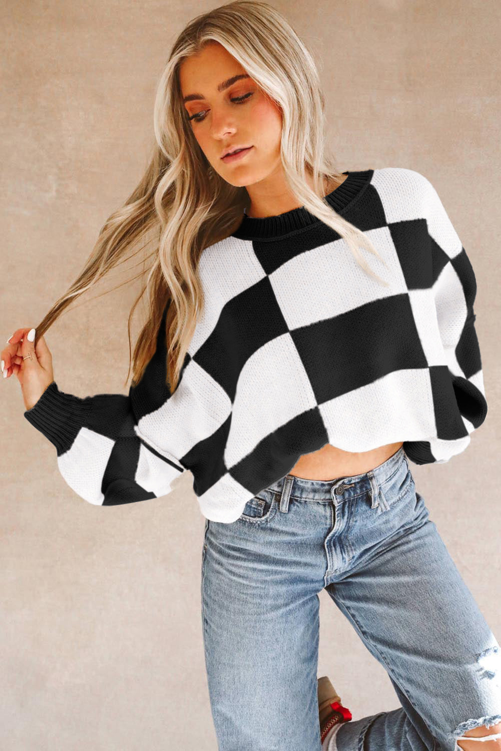 Black checkered bishop sleeve sweater in soft premium fabric for a modern look