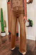 Coffee High Waist flare jeans in a vintage brown shade with button fly, raw hem, and seam detailing for elongating silhouette