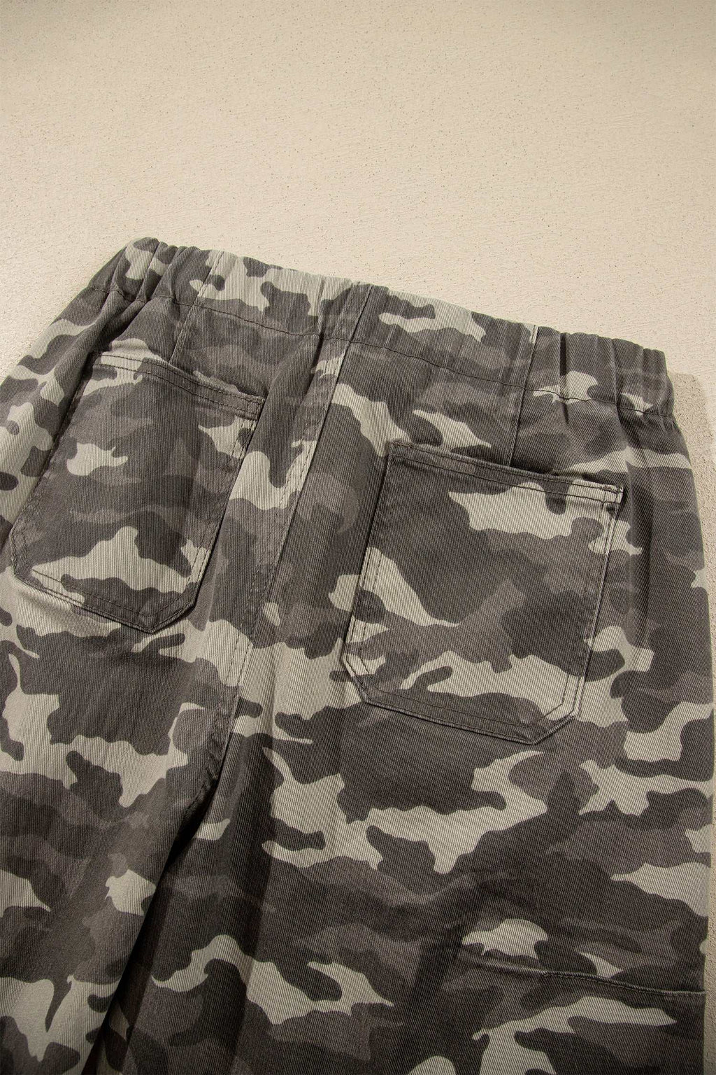 Khaki Leopard Drawstring relaxed-fit jeans with elastic waist and back pockets in a grey camo pattern