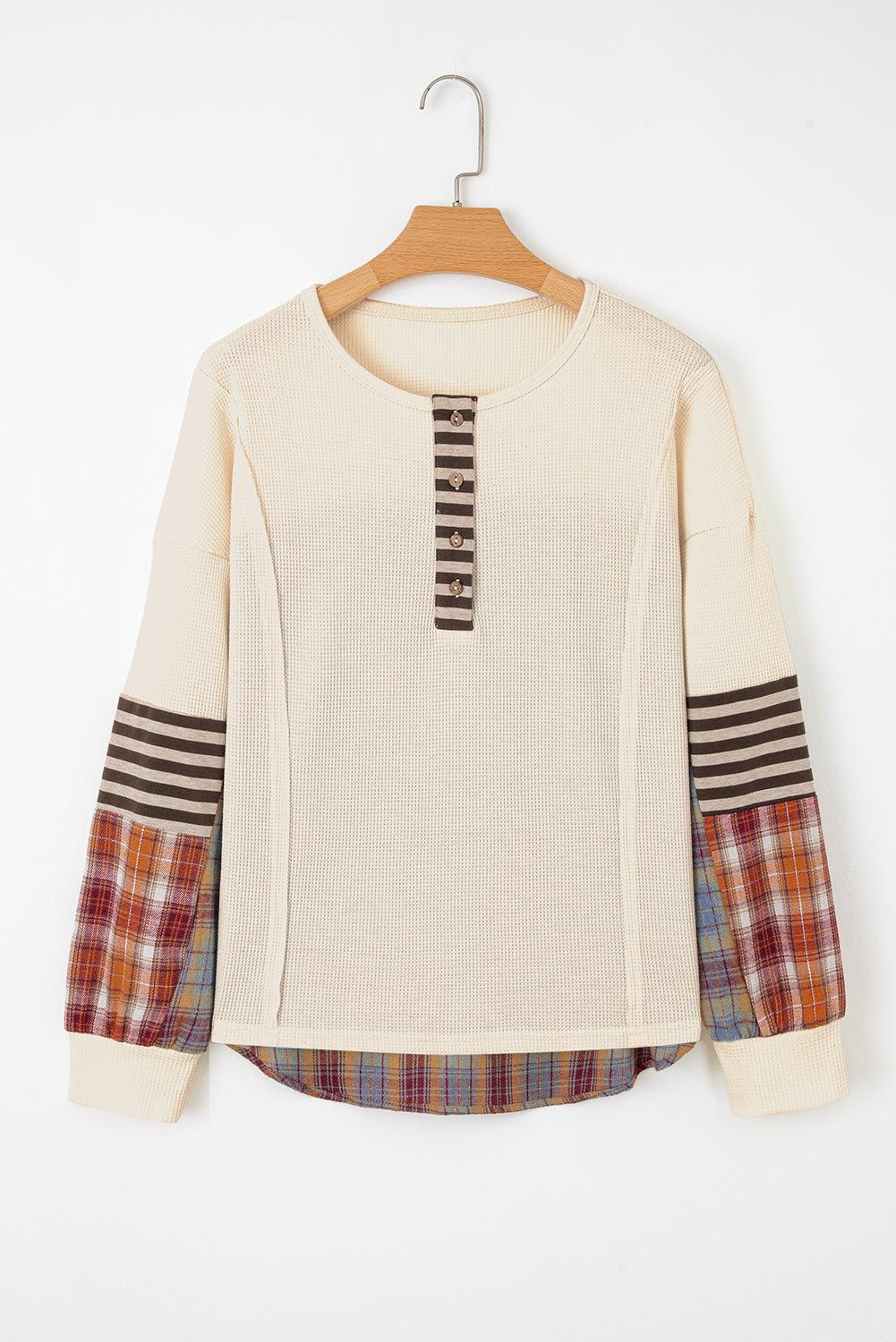 Straw Yellow Waffle Knit Henley top with cream body, striped brown sleeve cuffs, and multicolored plaid patchwork sleeves and hem
