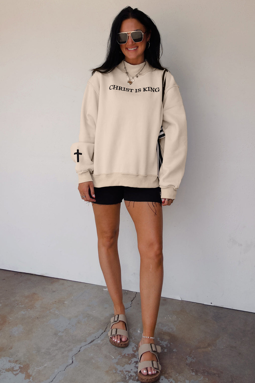 Original model full length view of the Beige CHRIST IS KING Embroidery High Neck Baggy Sweatshirt
