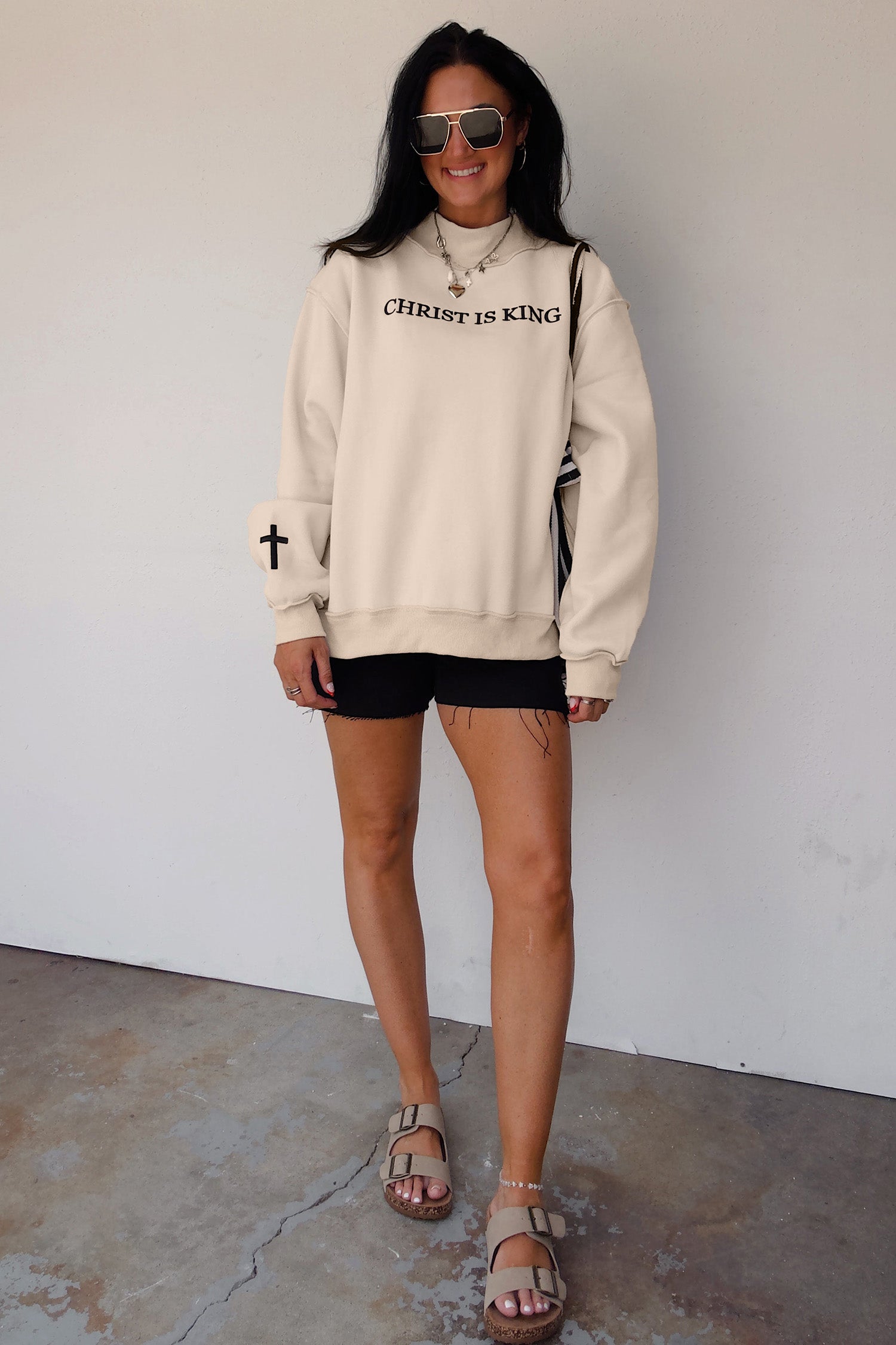 Original model full length view of the Beige CHRIST IS KING Embroidery High Neck Baggy Sweatshirt