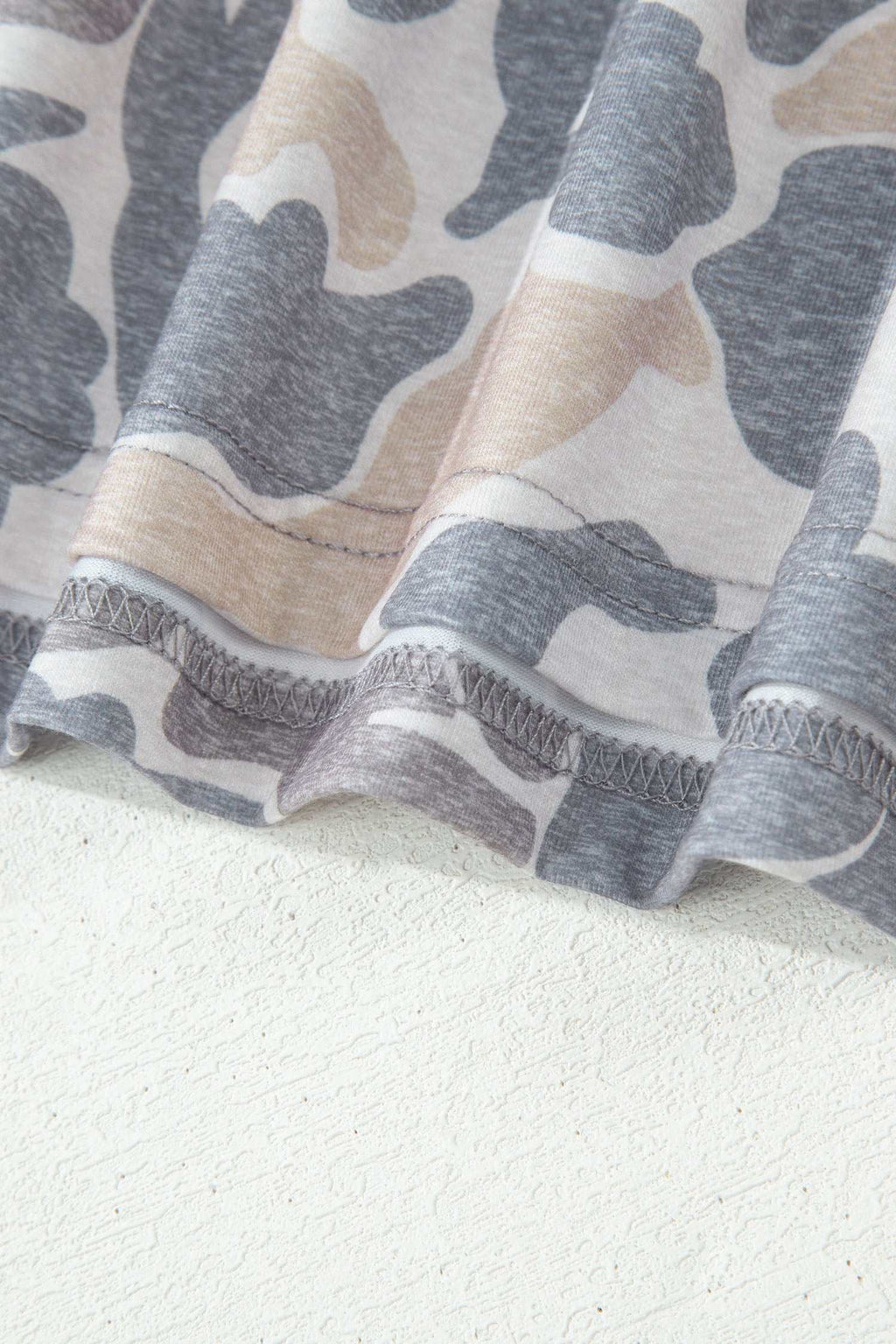 Retro Camo Print casual tee fabric with beige, gray, and white soft cotton material and retro camouflage pattern close-up.