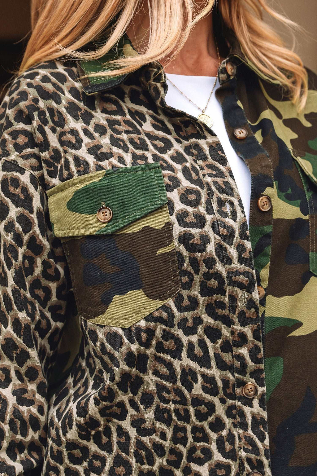 Oversized shacket featuring Brown Leopard Camo patchwork design with button closure and chest pocket detail