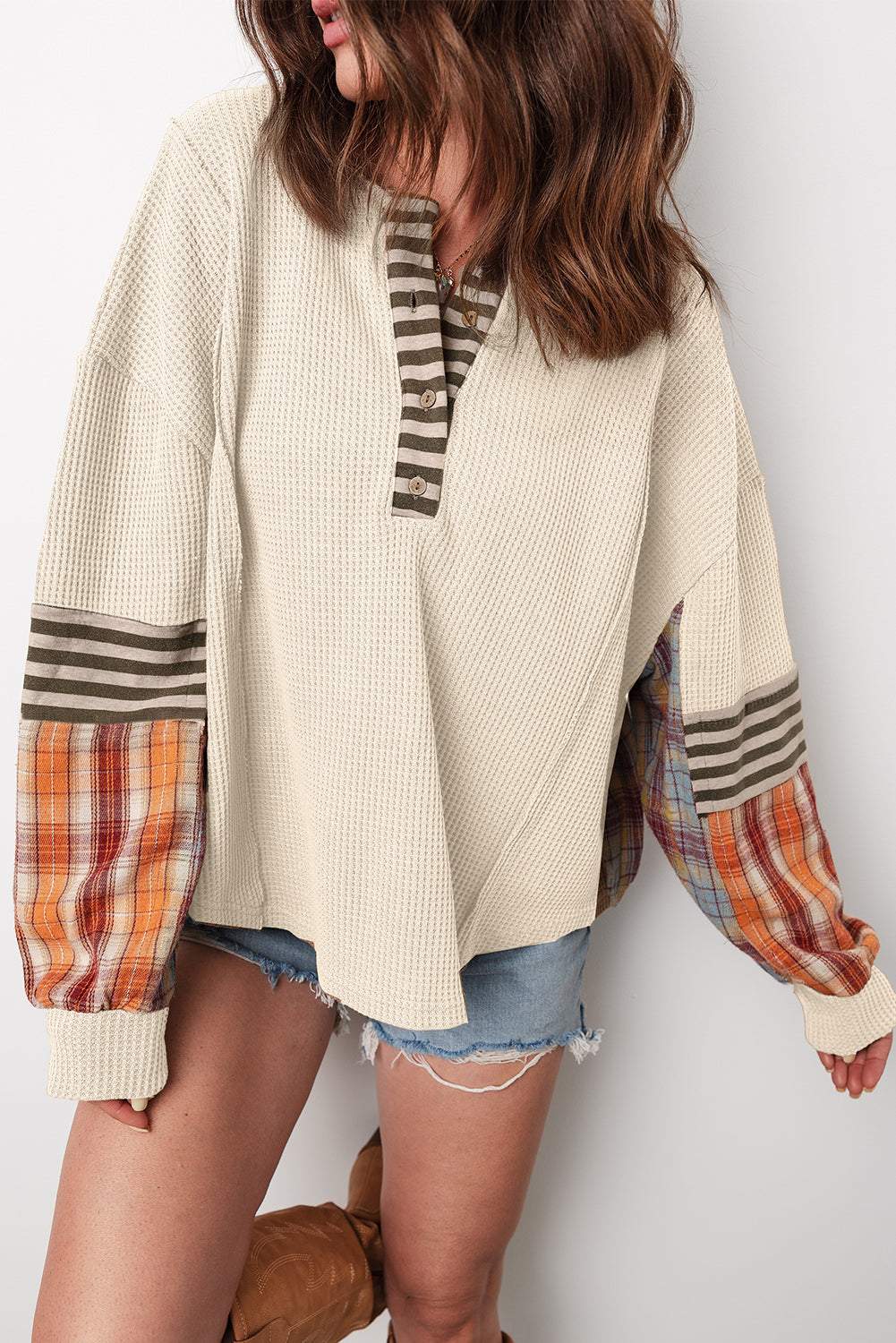 Straw Yellow Waffle Knit Henley top with beige textured fabric, striped collar and cuffs, and plaid patchwork sleeves.