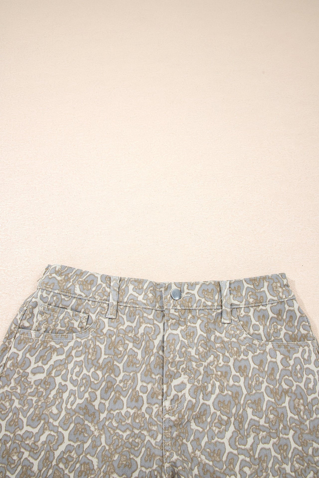 Khaki raw edge leopard print denim shorts with durable fabric and bold design