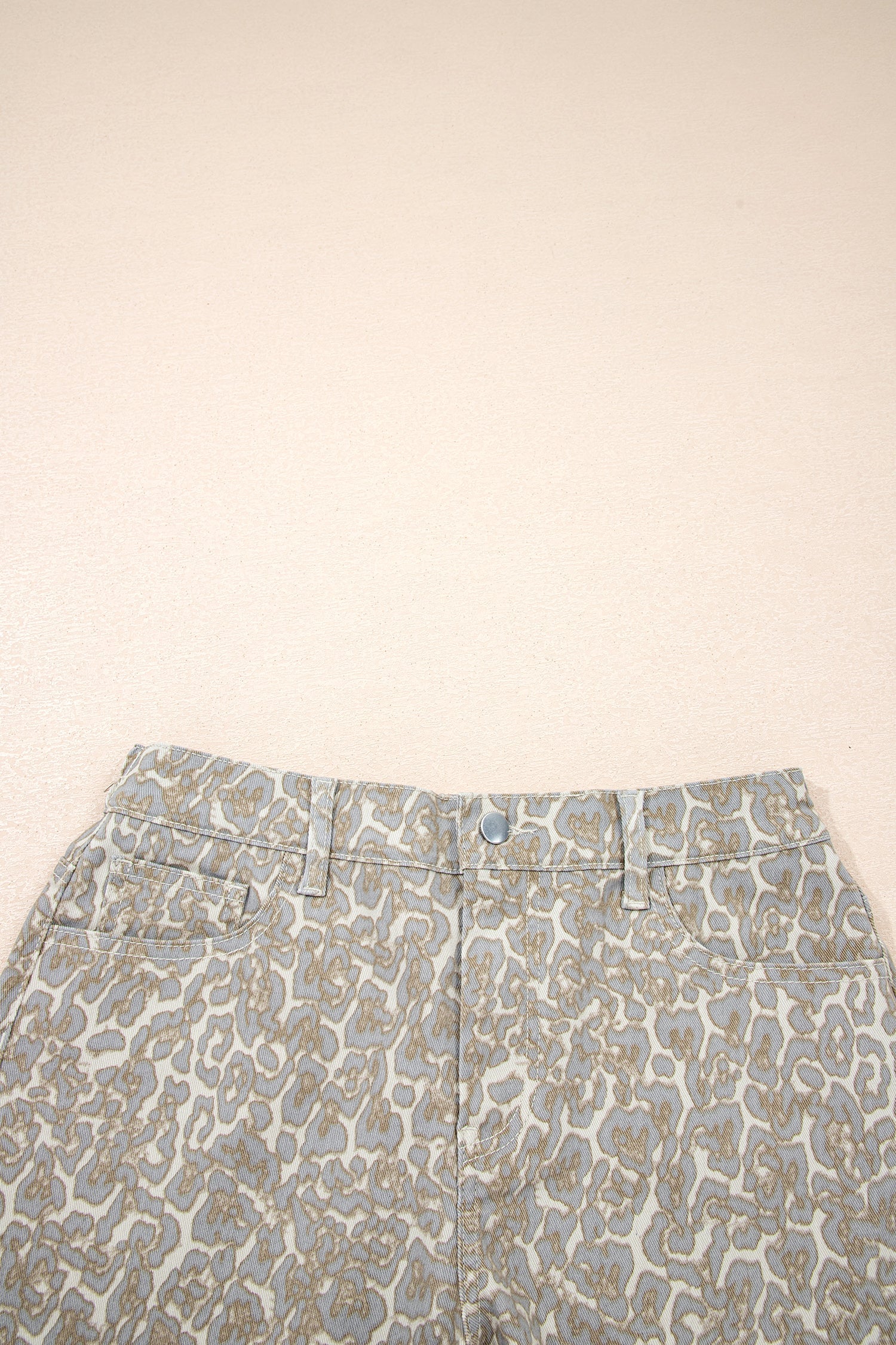 Khaki raw edge leopard print denim shorts with durable fabric and bold design