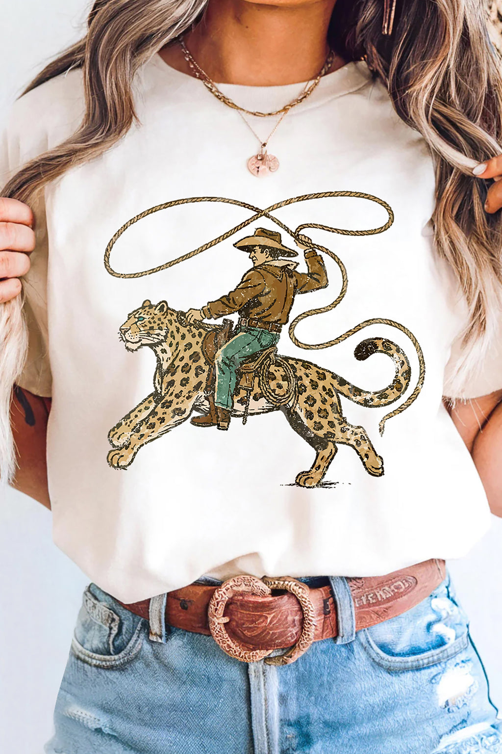 Women's white graphic tee with leopard rodeo cowboy print