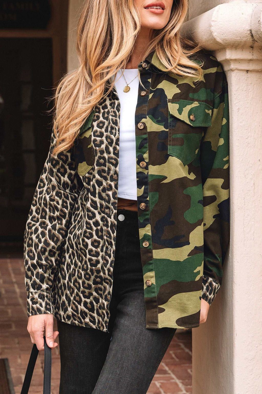 Oversized shirt jacket featuring a Brown Leopard Camo patchwork design with button closure and chest pockets.
