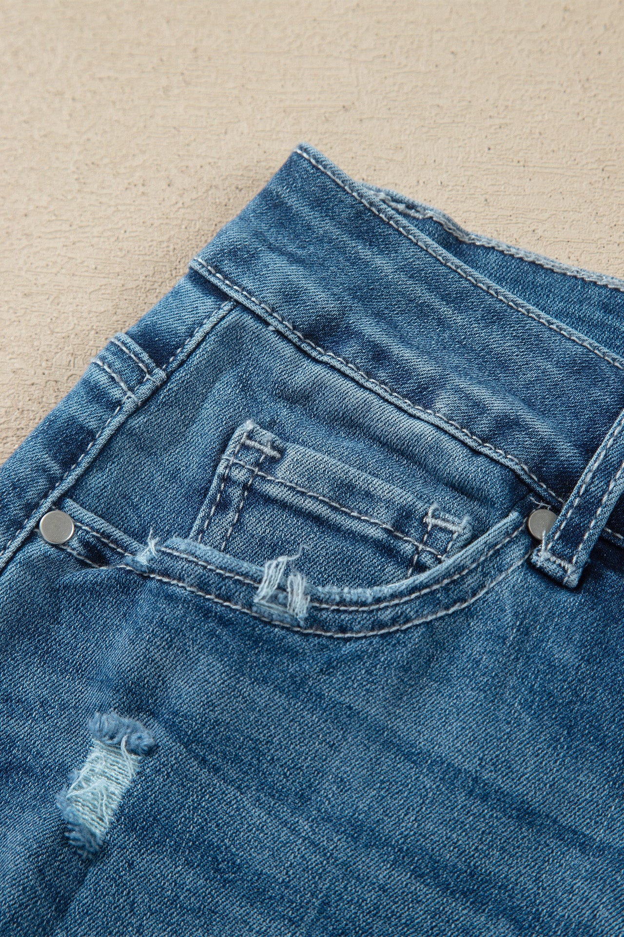 Ashleigh Blue high-waist flare jeans with frayed hems in classic denim style