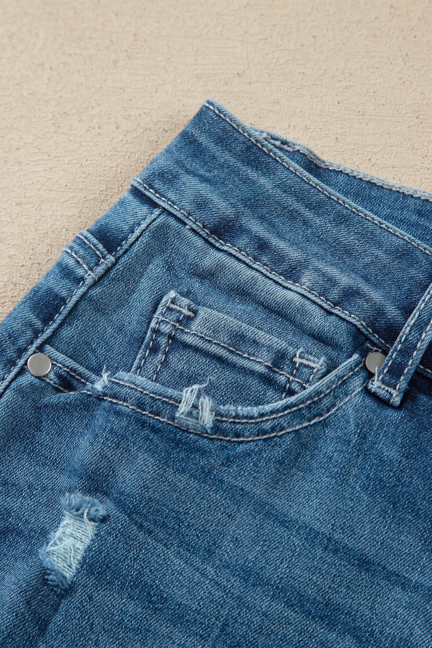Ashleigh Blue high-waist flare jeans with frayed hems in classic denim style