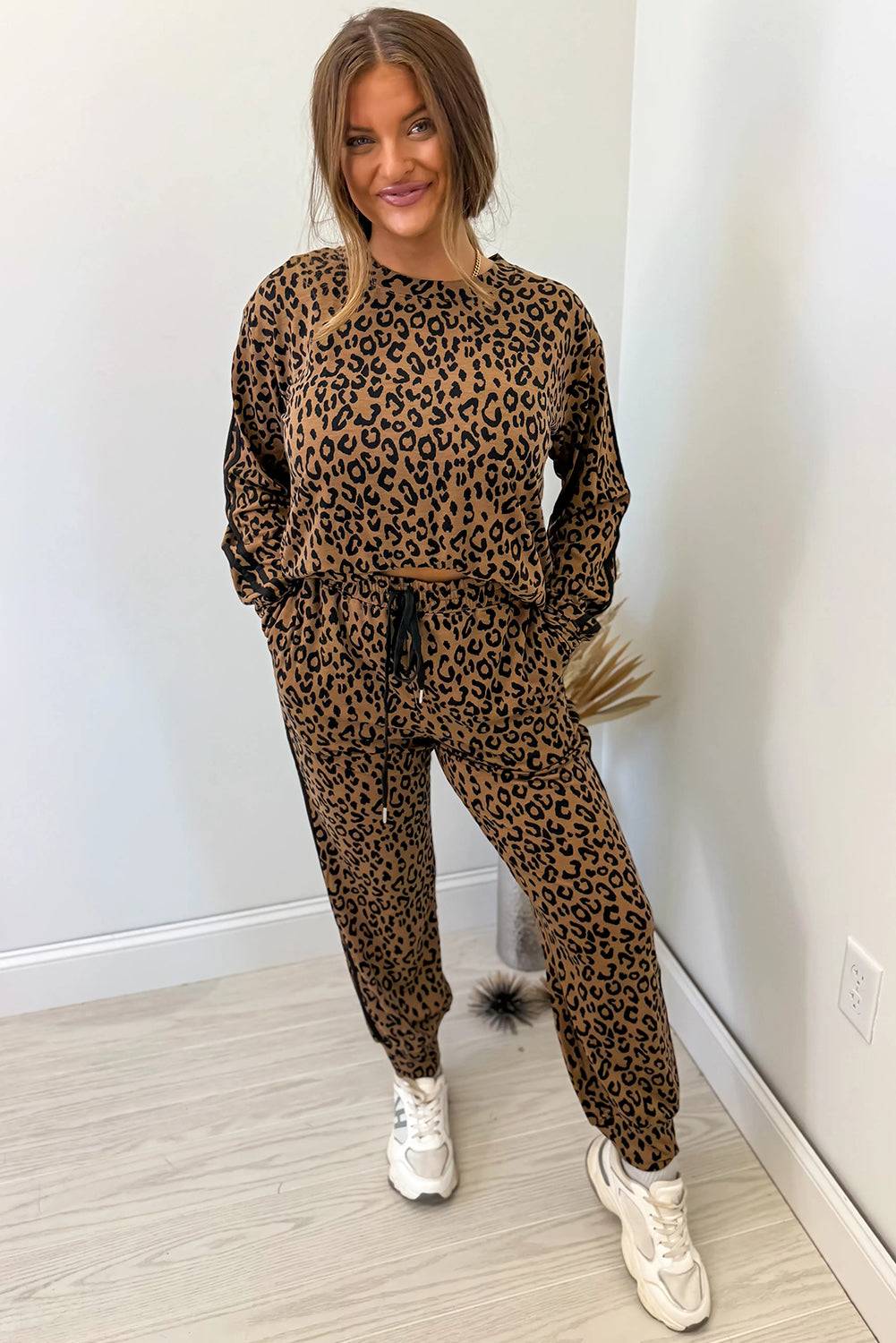 Brown Leopard Varsity two-piece set with leopard print, black varsity stripes, and drawstring jogger pants in soft fabric