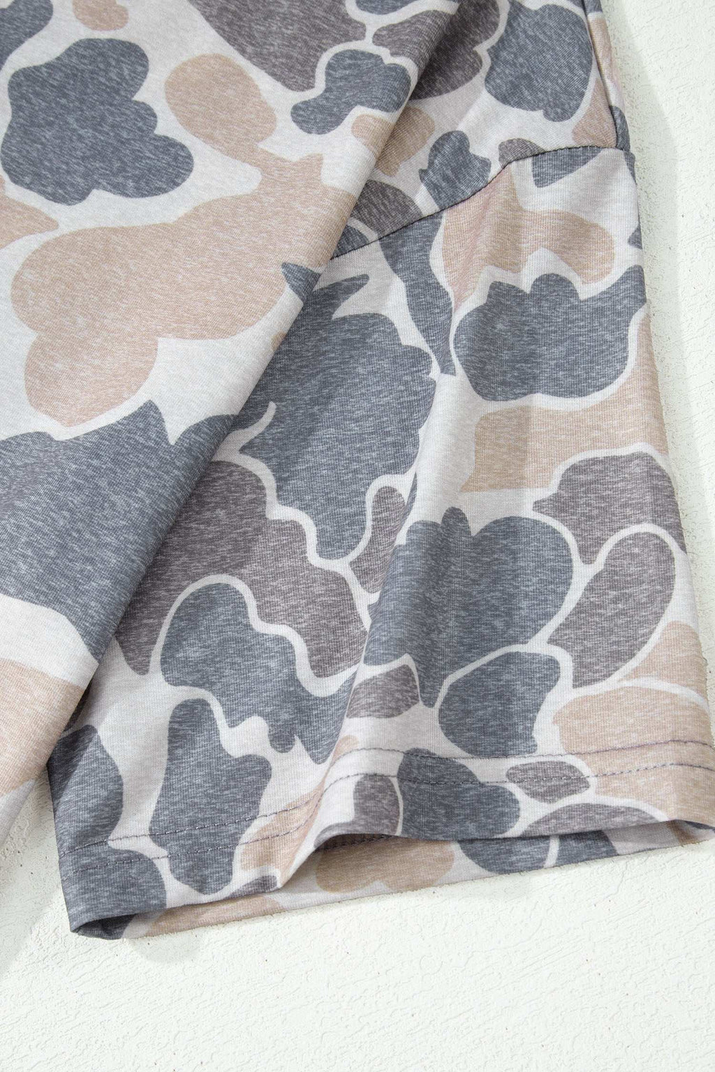 Retro Camo Print casual tee fabric detail in soft, breathable material with beige, gray, and white abstract camouflage pattern