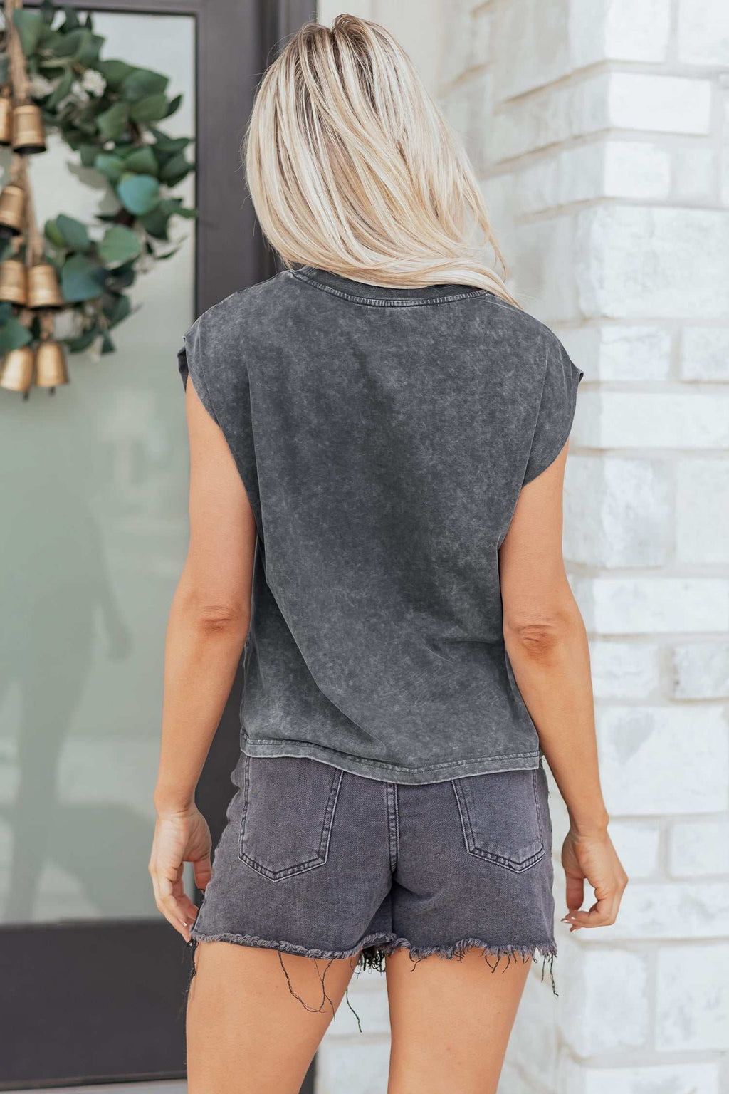 Cowboys & Beer charcoal mineral wash sleeveless tank top with a faded finish and a relaxed fit shown from the back
