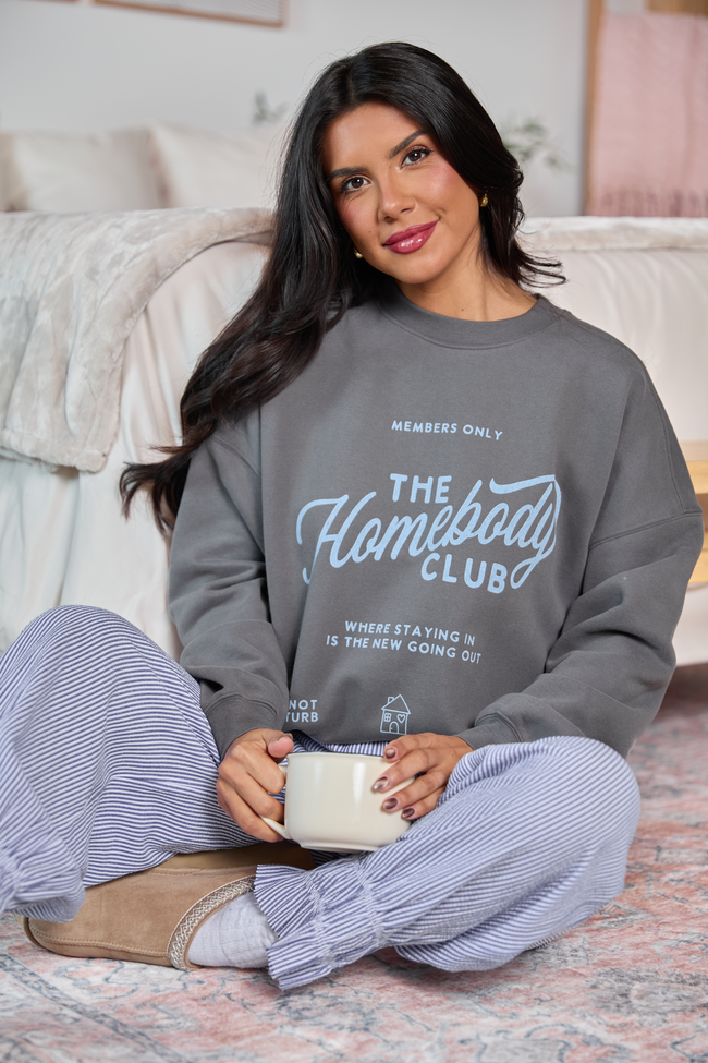 Dark grey sweatshirt with Homebody Club graphic