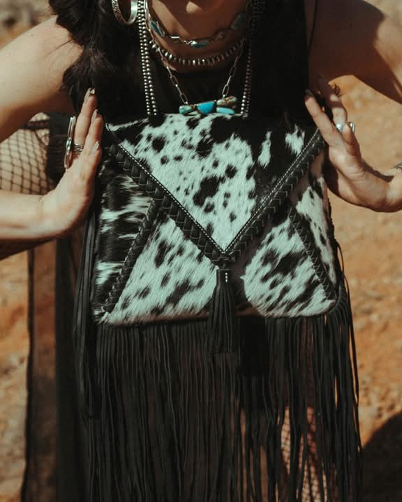 The Xia Haute Southern Hyde cowhide purse with hand woven fringe and two adjustable straps by Beth Marie Exclusive