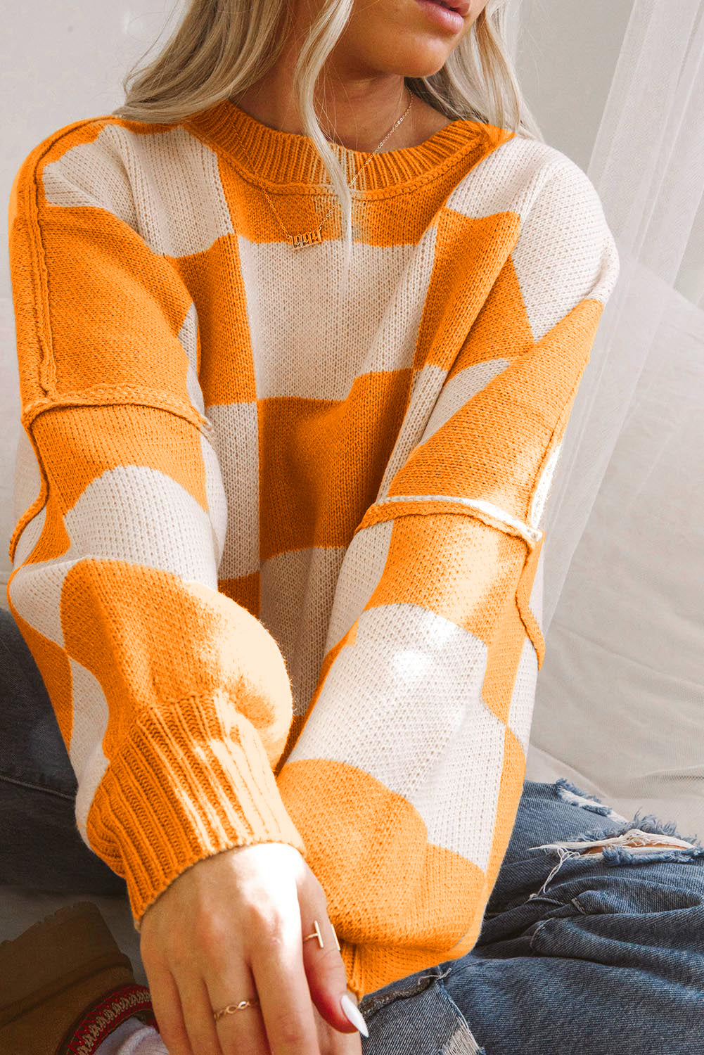 Black checkered bishop sleeve sweater in premium soft fabric for modern elevated look
