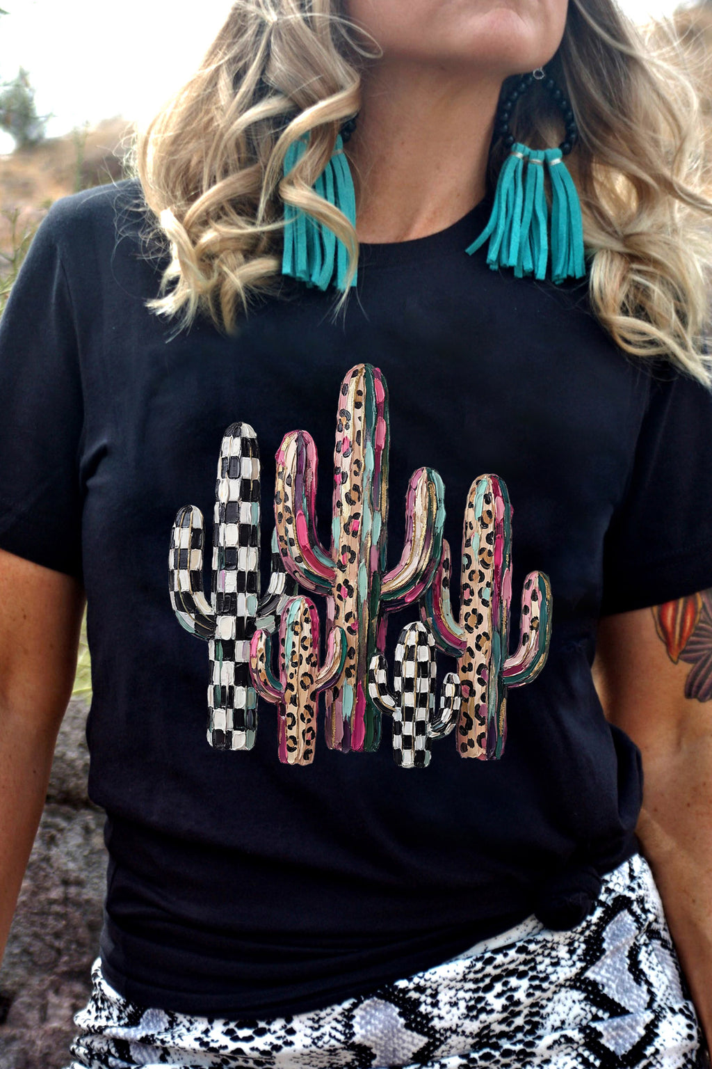 Women's black relaxed tee with mixed pattern cactus graphic