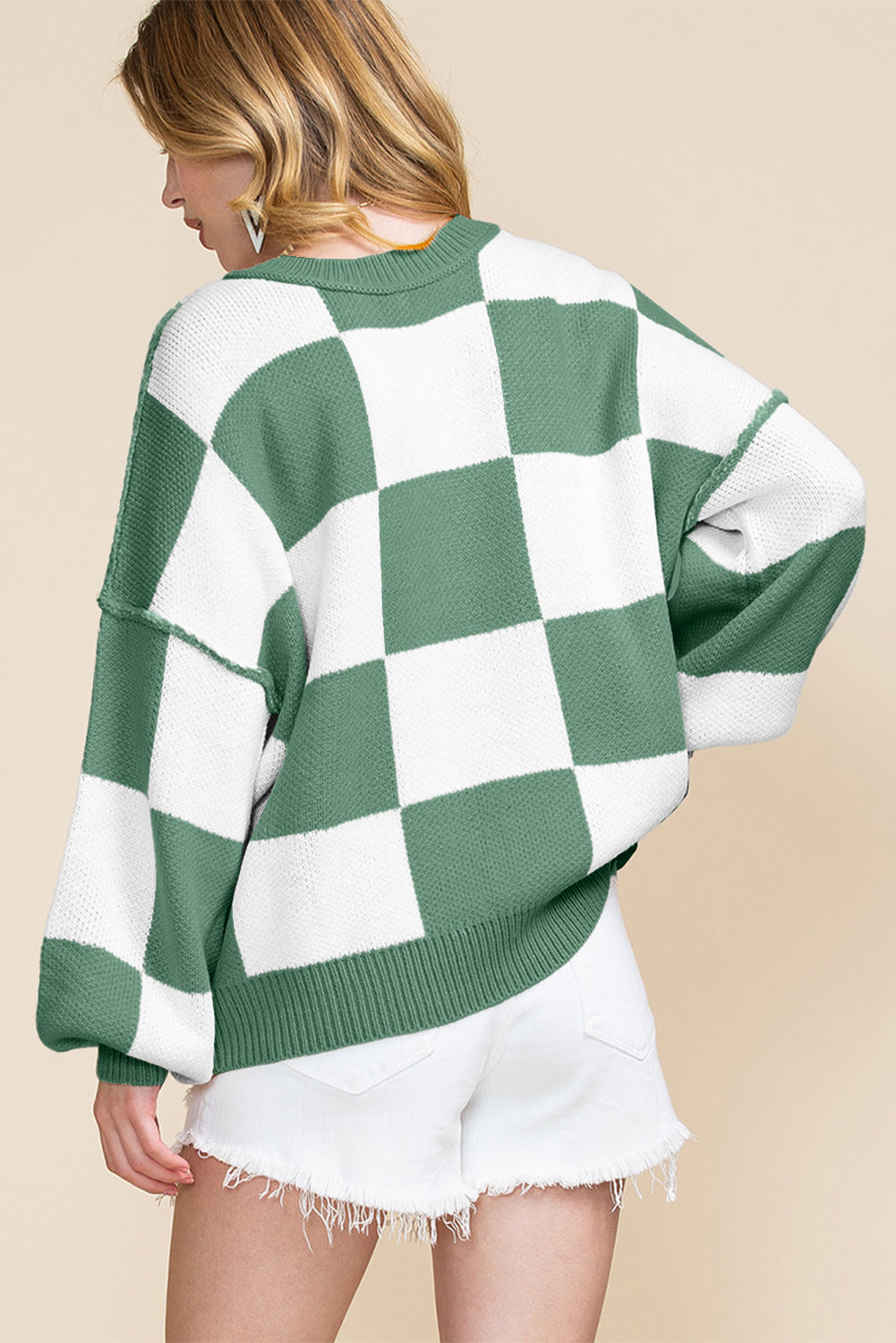 Black checkered bishop sleeve sweater in soft fabric for a modern look