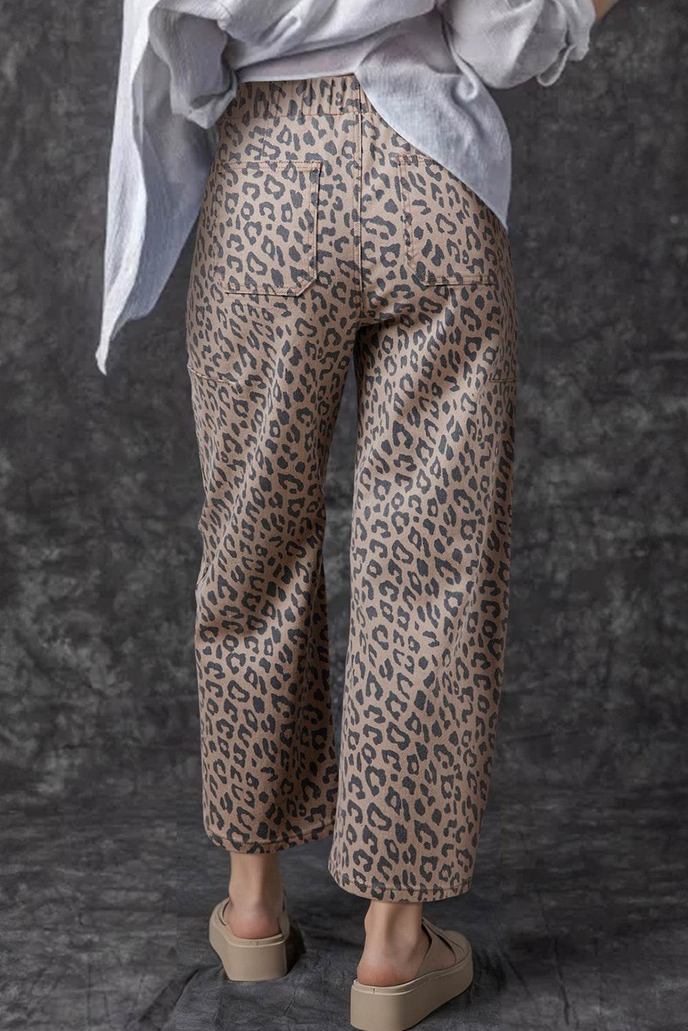 Khaki Leopard Drawstring relaxed fit barrel jeans with elastic waist and leopard print pattern in brown and black tones.