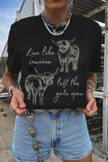 Black Western Cow Print Graphic Tee featuring beige western cow illustrations and script text on a crew neck cotton material.