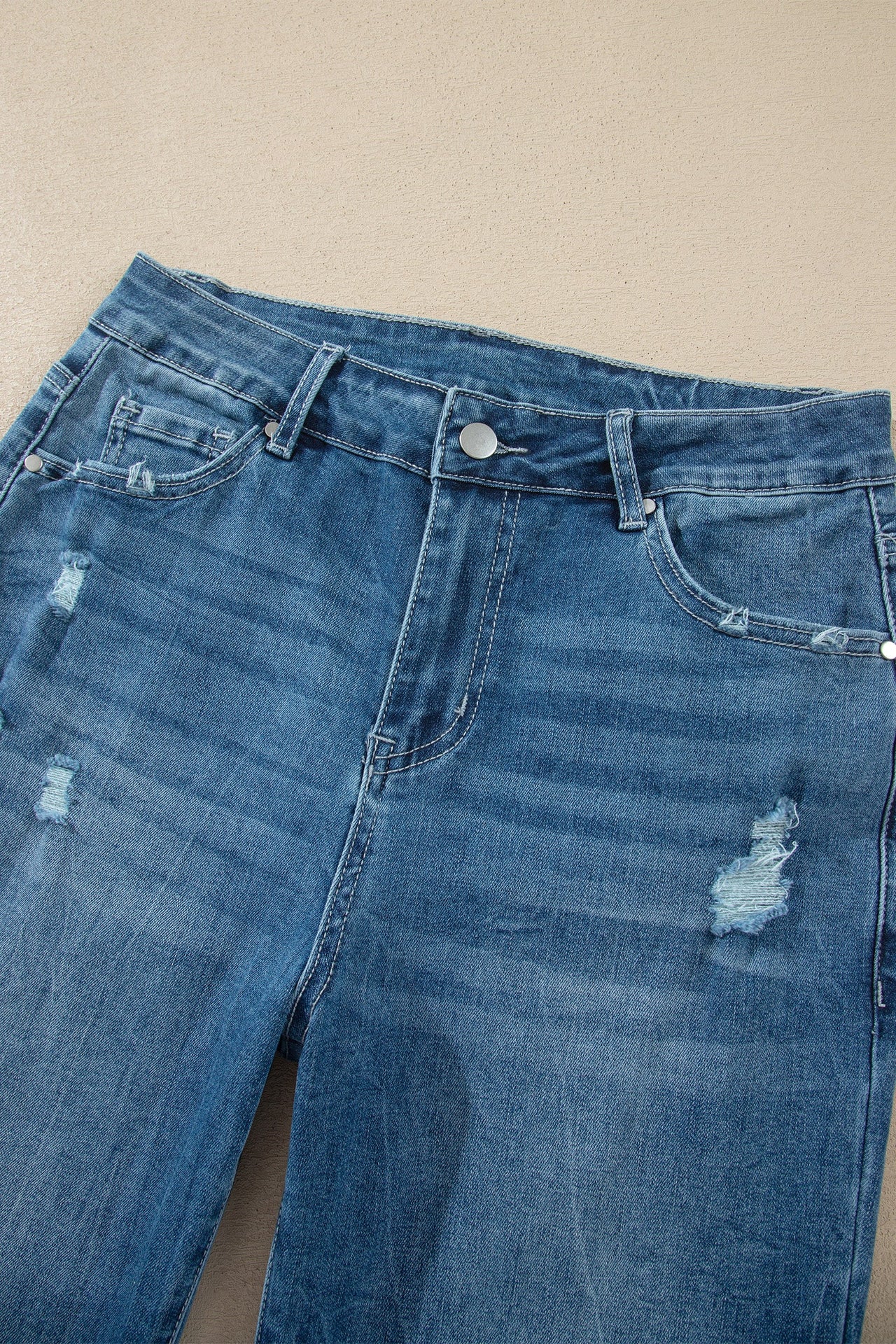 Ashleigh Blue high-waist flare jeans with frayed hem and classic denim style