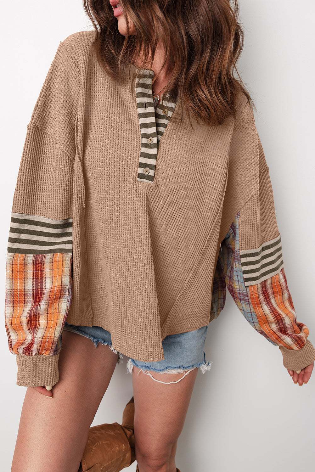 Straw Yellow Waffle Knit Henley top with striped neckline, plaid and striped patchwork sleeves, and textured cozy fabric