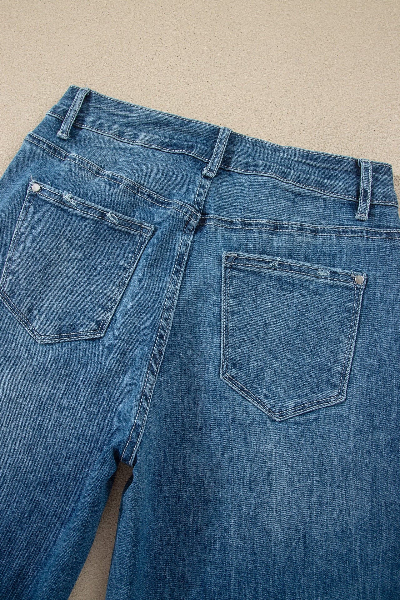 Ashleigh Blue high-waist flare jeans with frayed hems and classic denim style