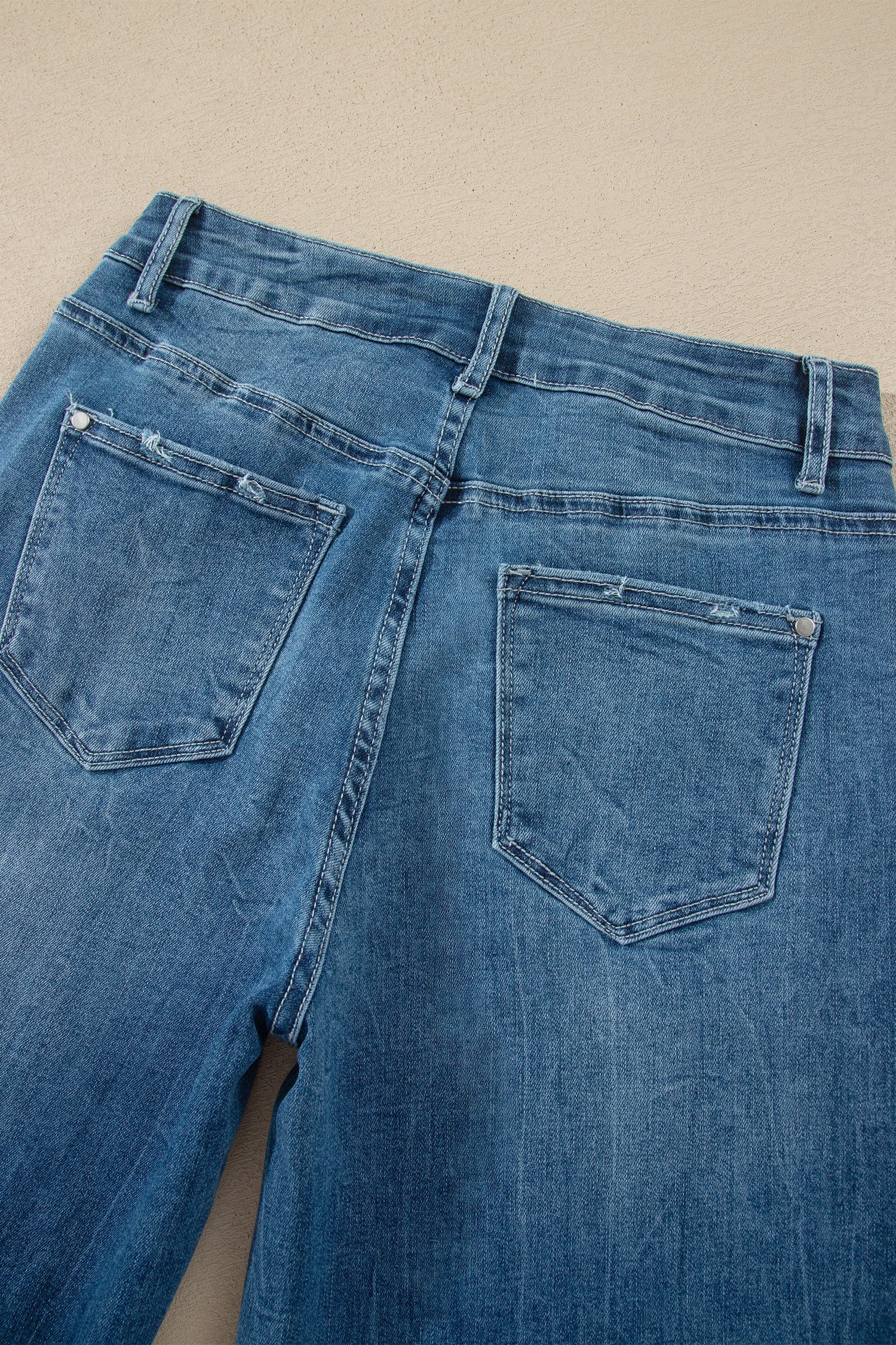 Ashleigh Blue high-waist flare jeans with frayed hems and classic denim style