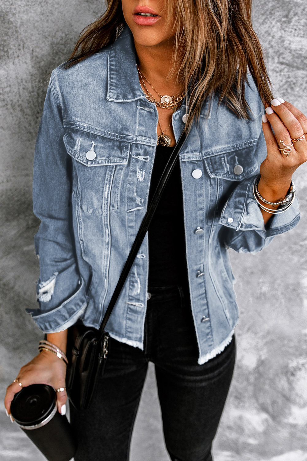Women's sky blue distressed denim jacket with raw hem