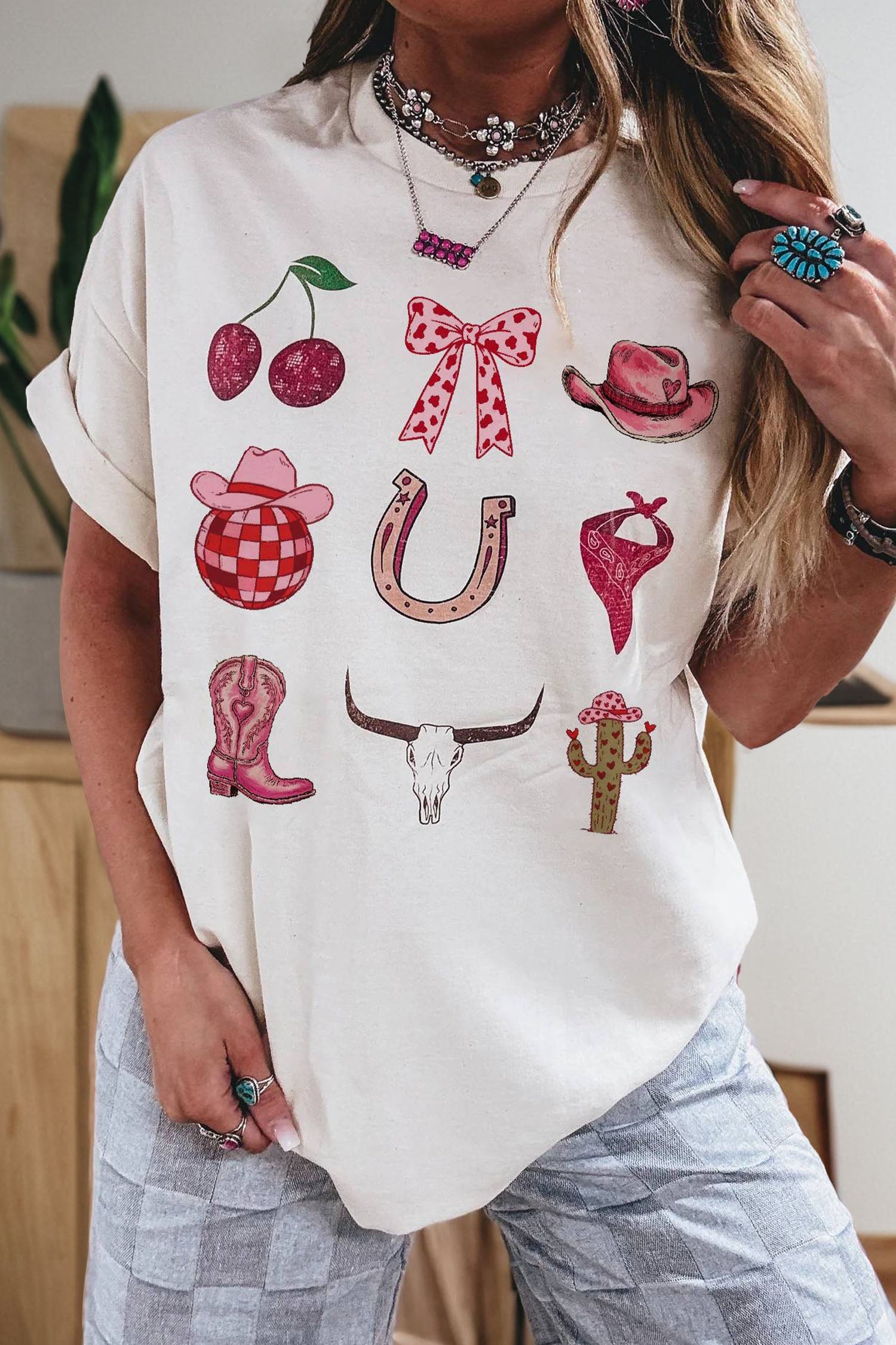 White Coquette Cowgirl Elements relaxed tee with hearts, boots, and stars graphics