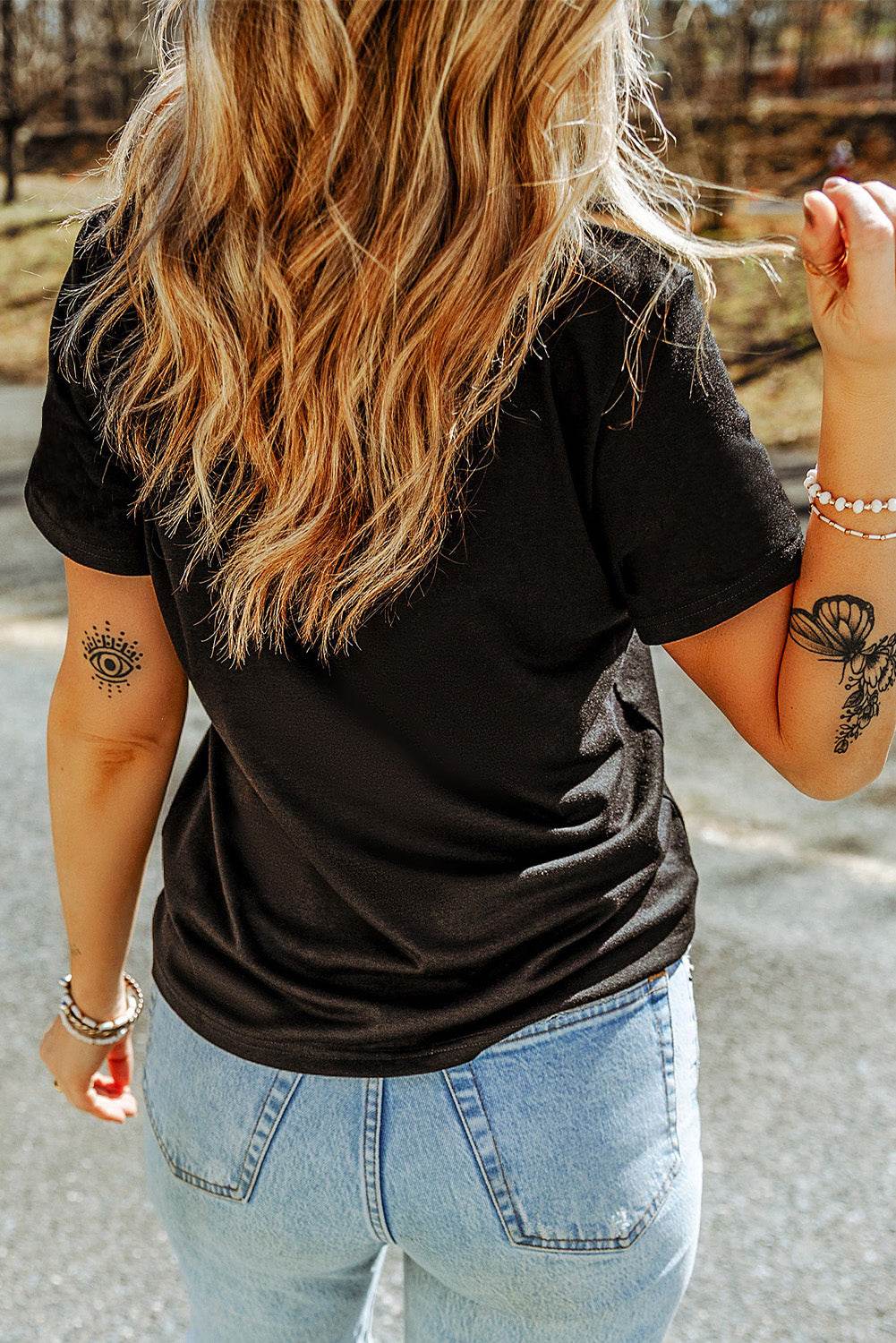 Black Rhinestone Western Graphic Tee in black cotton blend featuring a sparkling rhinestone western pattern on the front.