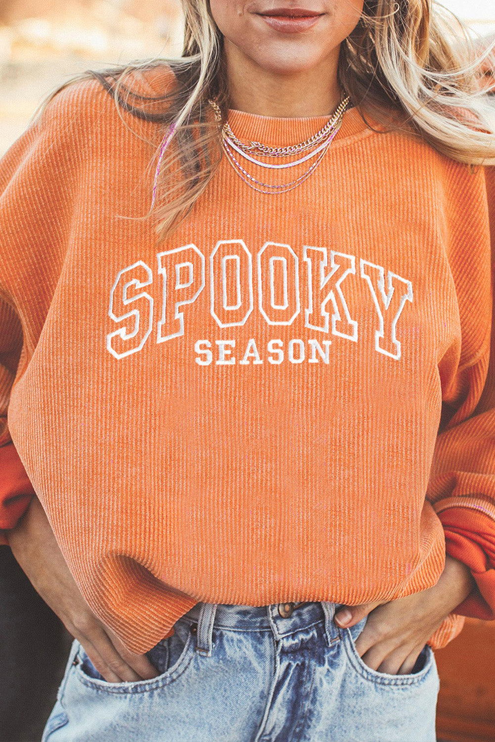 Women's orange twisted-rib sweatshirt with embroidered SPOOKY SEASON lettering
