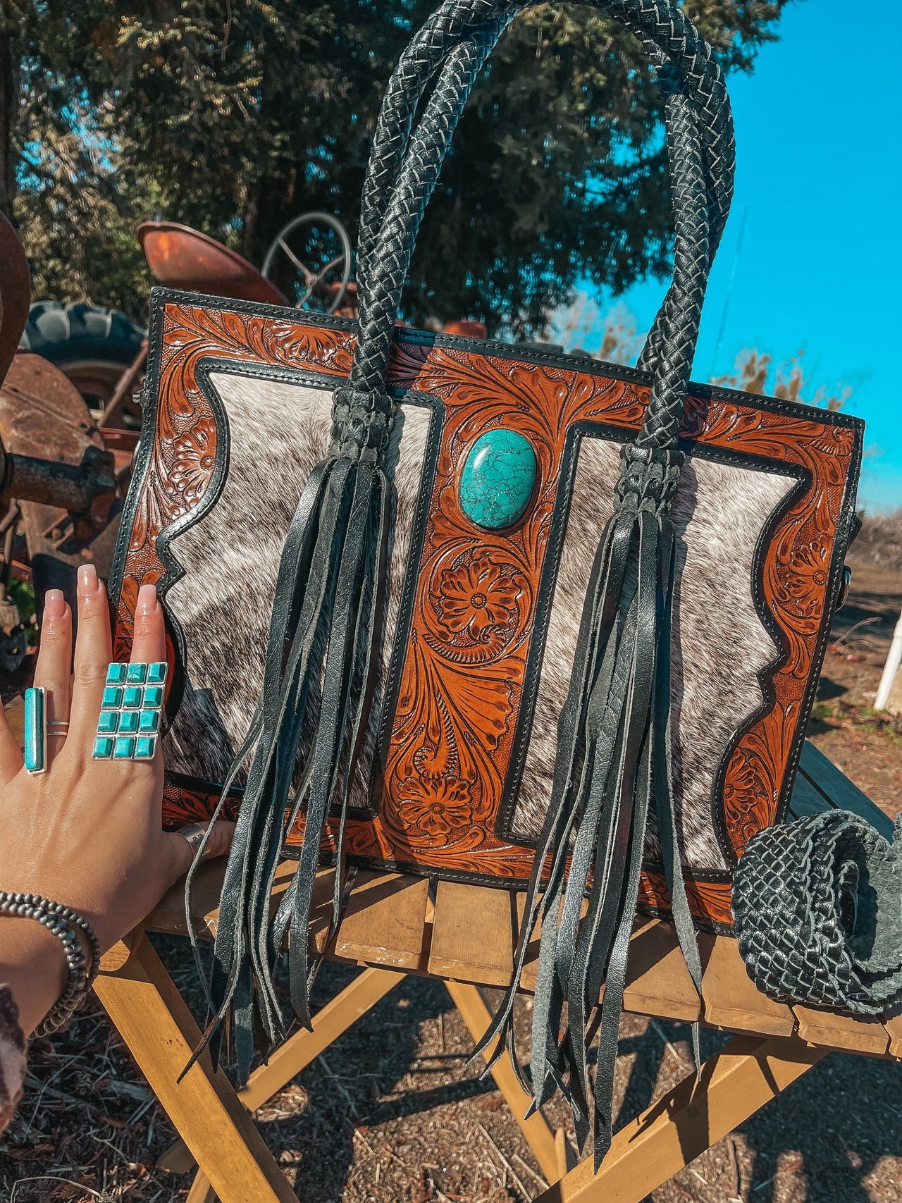 The Roper Luxe Western cowhide purse with braided strap and velvet interior by Beth Marie