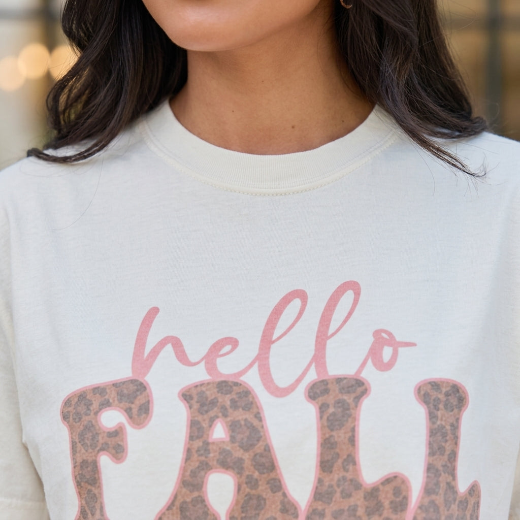 Macro close-up detail of Hello Fall Leopard Ivory Graphic Tee fabric and printed lettering