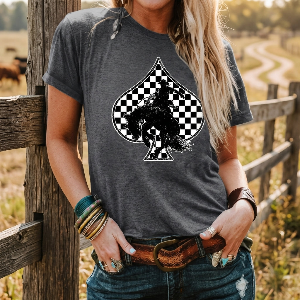 Outdoor lifestyle shot of the Redeo Check Spades Western Graphic T-Shirt by a ranch fence